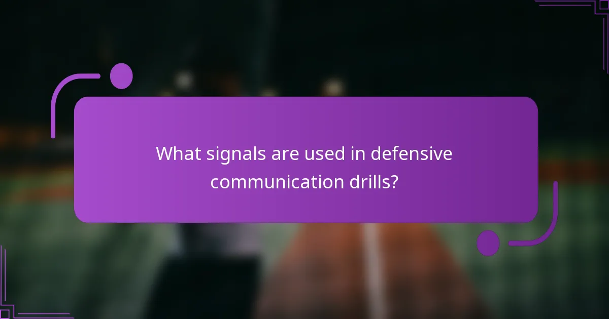 What signals are used in defensive communication drills?
